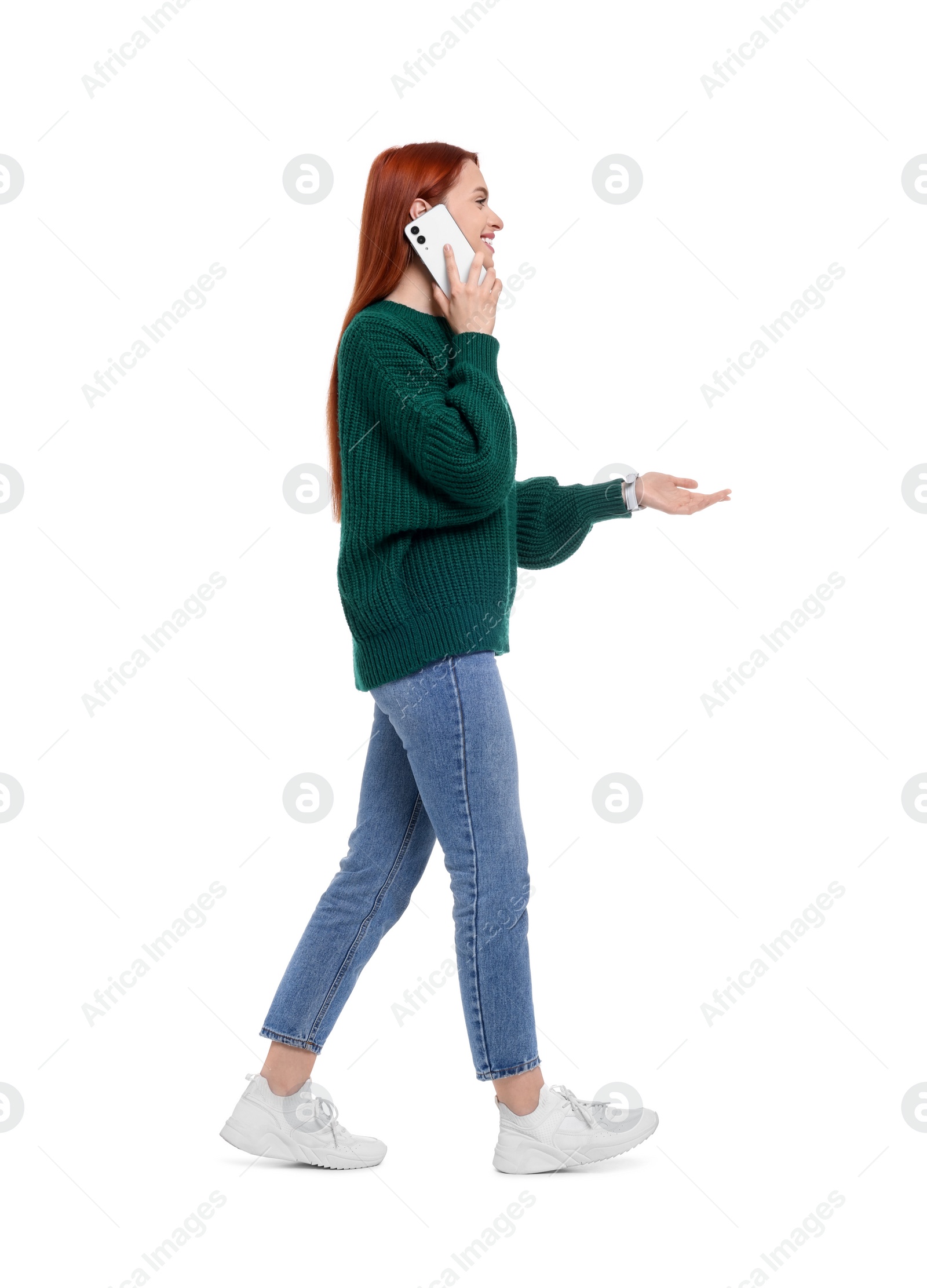 Photo of Happy woman talking on smartphone against white background