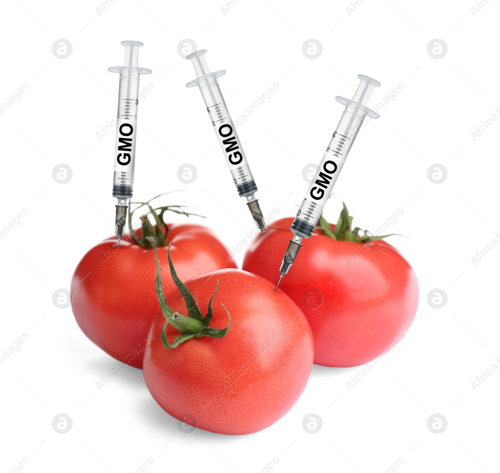 Image of Syringes with labels GMO in tomatoes on white background