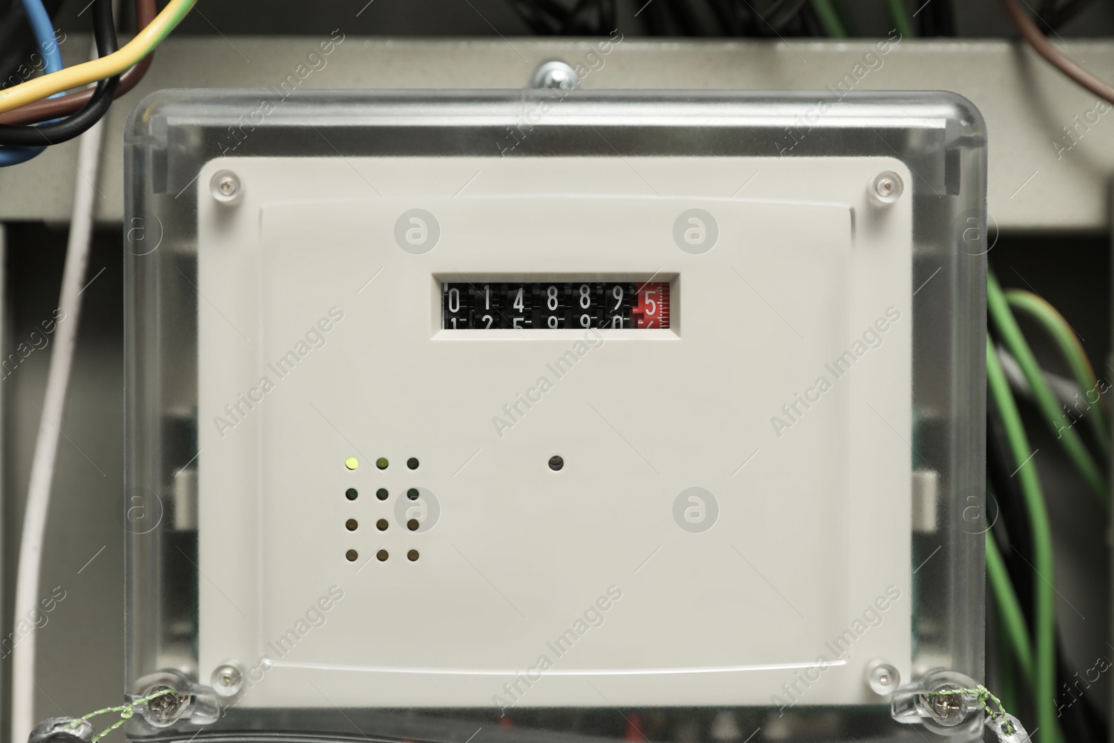 Photo of Electric meter and wires in fuse box, closeup