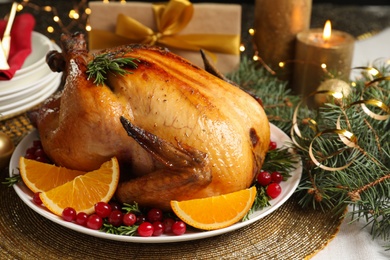 Photo of Delicious roasted turkey served for Christmas dinner on table