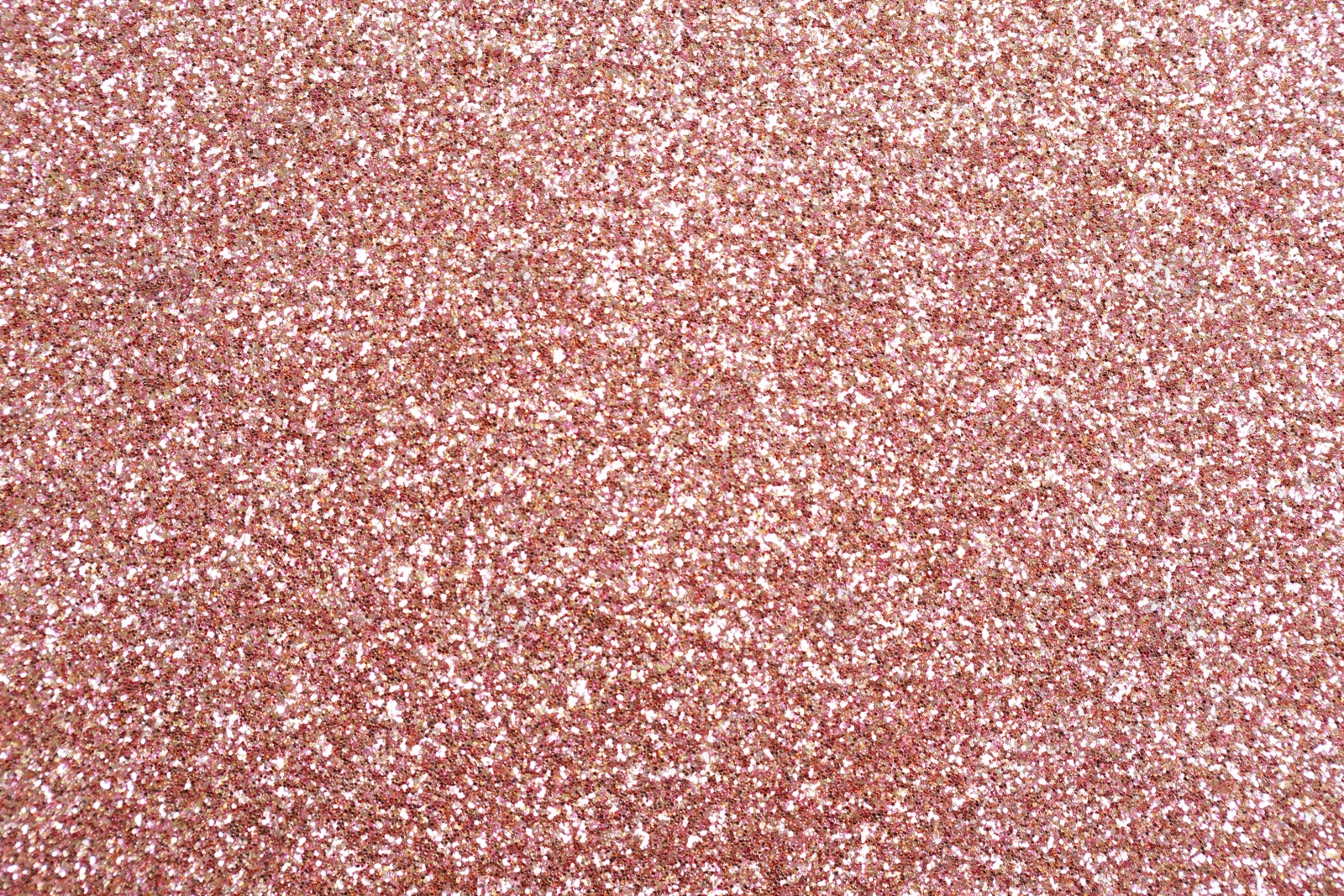 Photo of Beautiful rose gold shiny glitter as background, top view