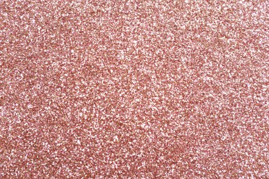 Beautiful rose gold shiny glitter as background, top view