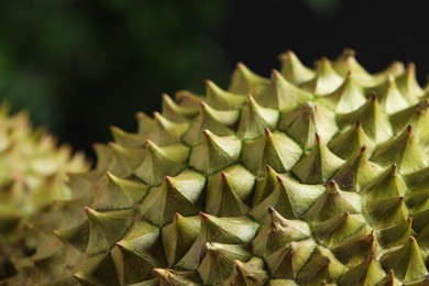 Photo of Closeup view of ripe durian on blurred background