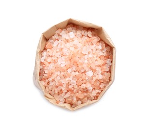 Photo of Pink Himalayan salt in paper bag isolated on white, top view