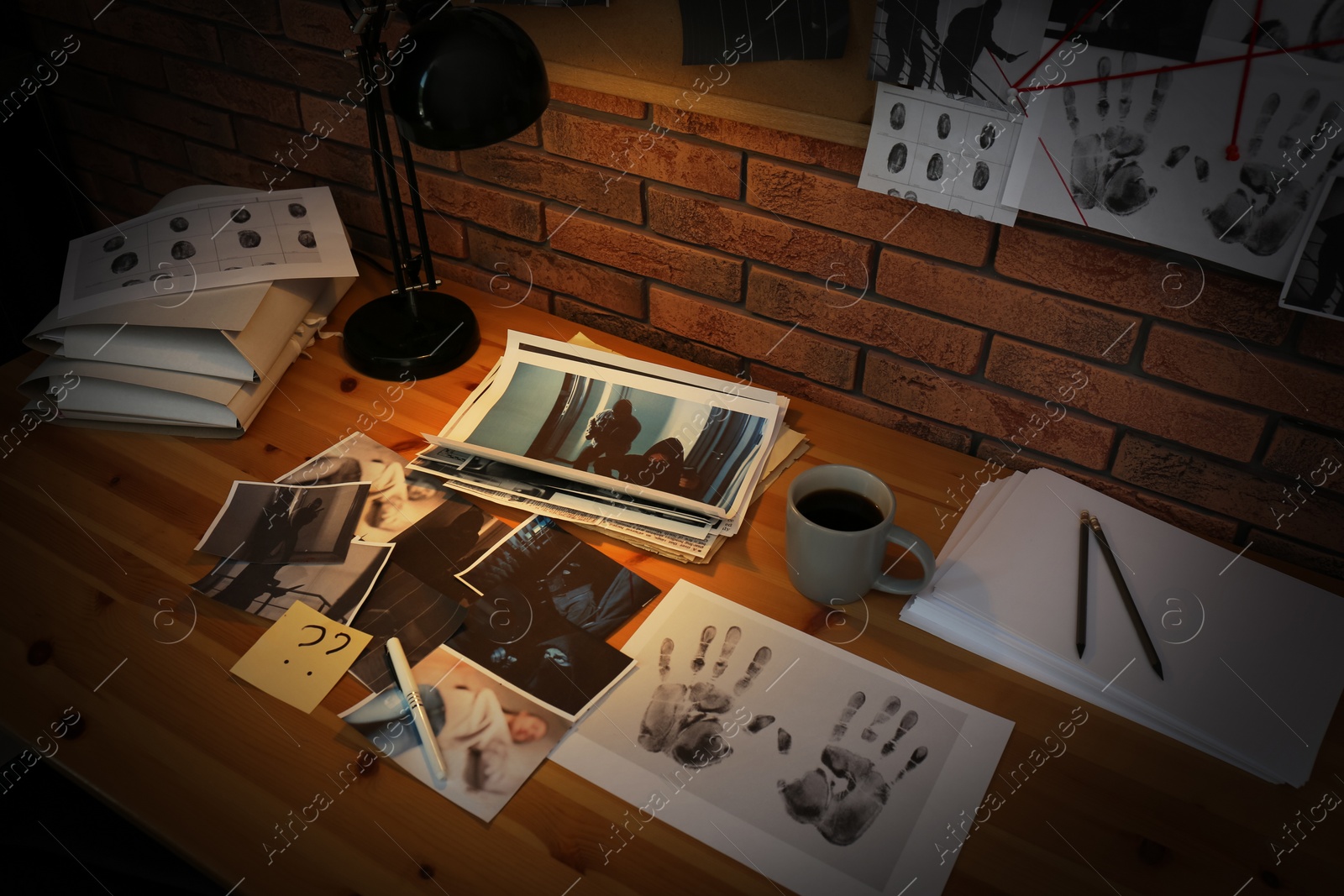 Photo of Detective workplace near brick wall in office