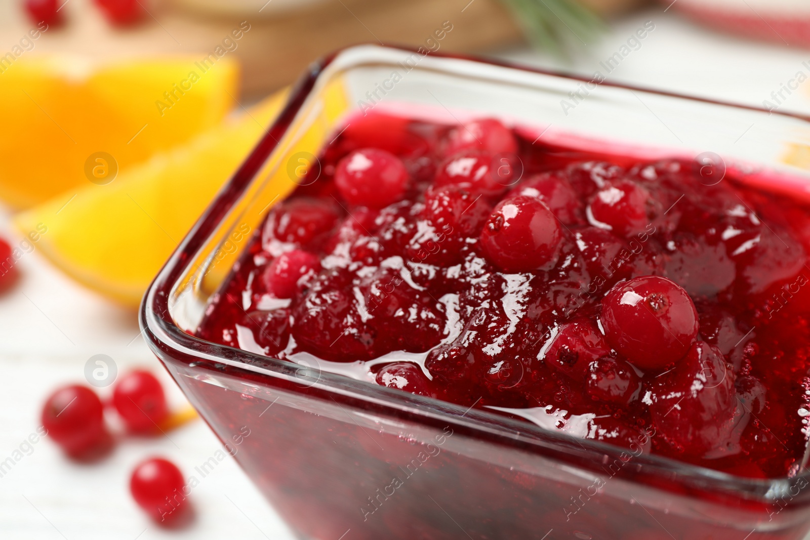 Photo of Delicious cranberry sauce in bowl, closeup view