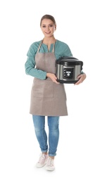 Photo of Full length portrait of young woman with modern multi cooker on white background