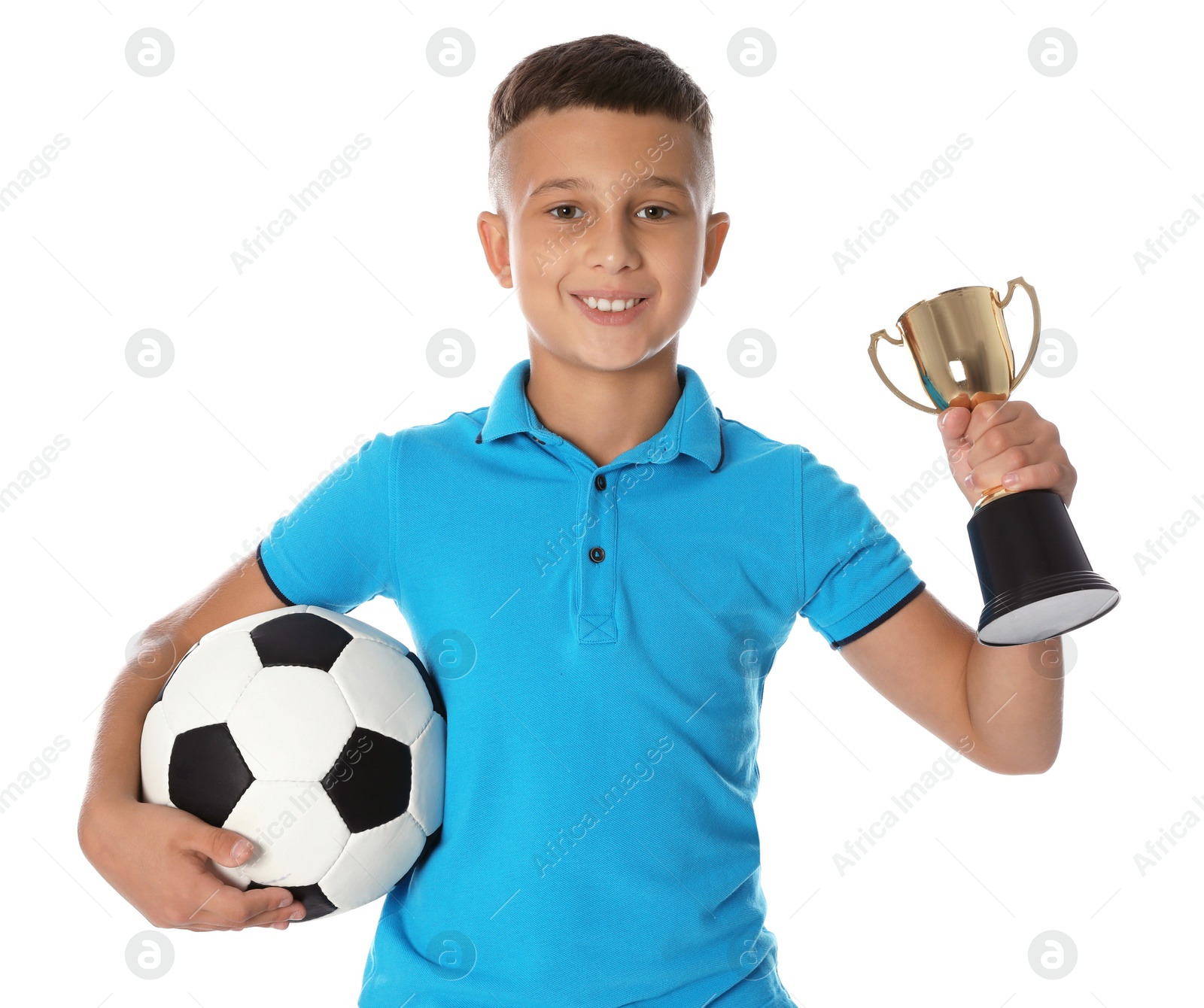 Photo of Happy boy with golden winning cup and soccer ball on white background