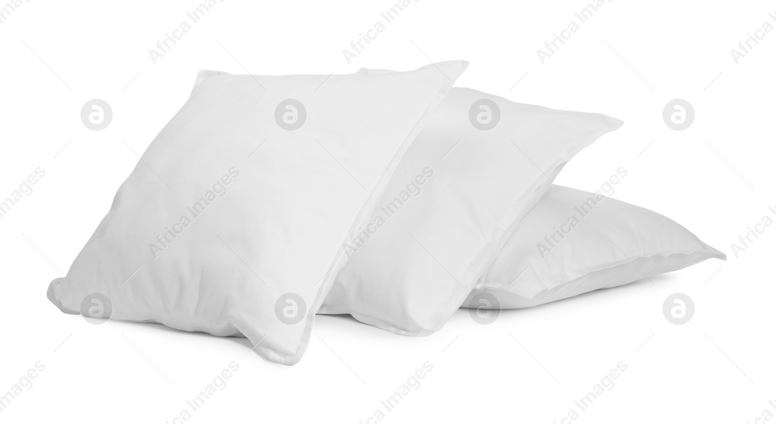 Photo of Three new soft pillows isolated on white