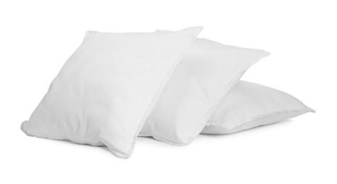 Photo of Three new soft pillows isolated on white