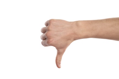 Photo of Man showing thumb down sign on white background, closeup. Body language