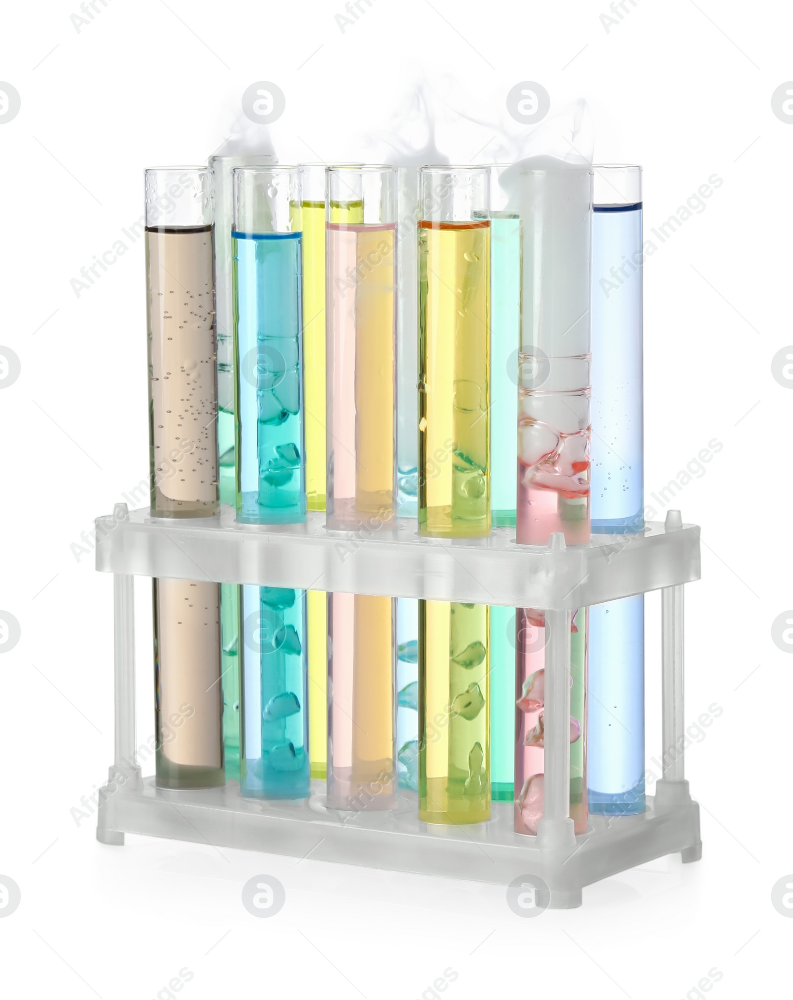 Photo of Test tubes with colorful liquids and steam isolated on white. Chemical reaction