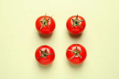 Photo of Flat lay composition with ripe cherry tomatoes on color background