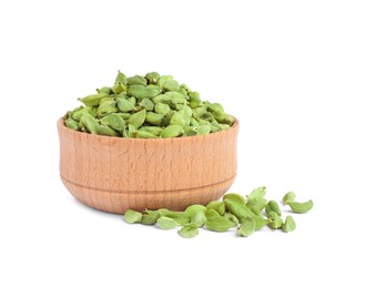 Photo of Wooden bowl and dry cardamom seeds on white background