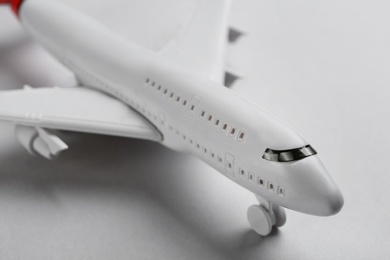 Photo of Toy airplane on light background, closeup view
