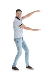 Man in casual clothes holding something on white background