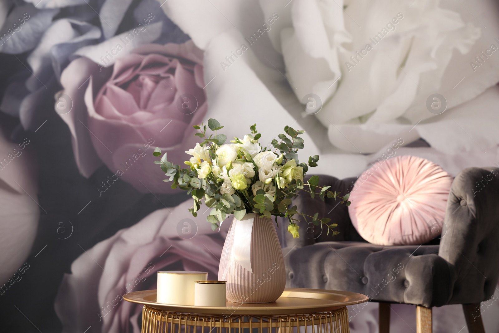 Photo of Beautiful bouquet of flowers on table in room. Stylish interior design