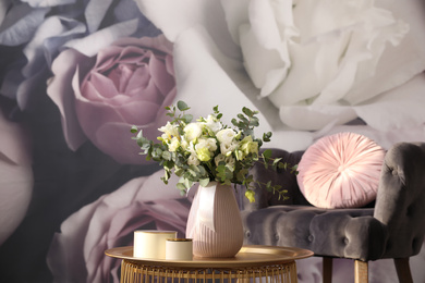 Beautiful bouquet of flowers on table in room. Stylish interior design