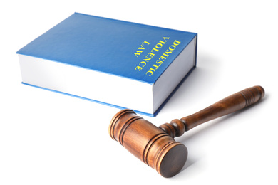 Photo of Domestic violence law book and wooden gavel on white background