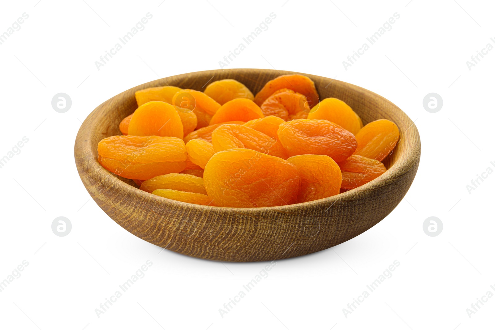 Photo of Wooden bowl with tasty dried apricots isolated on white