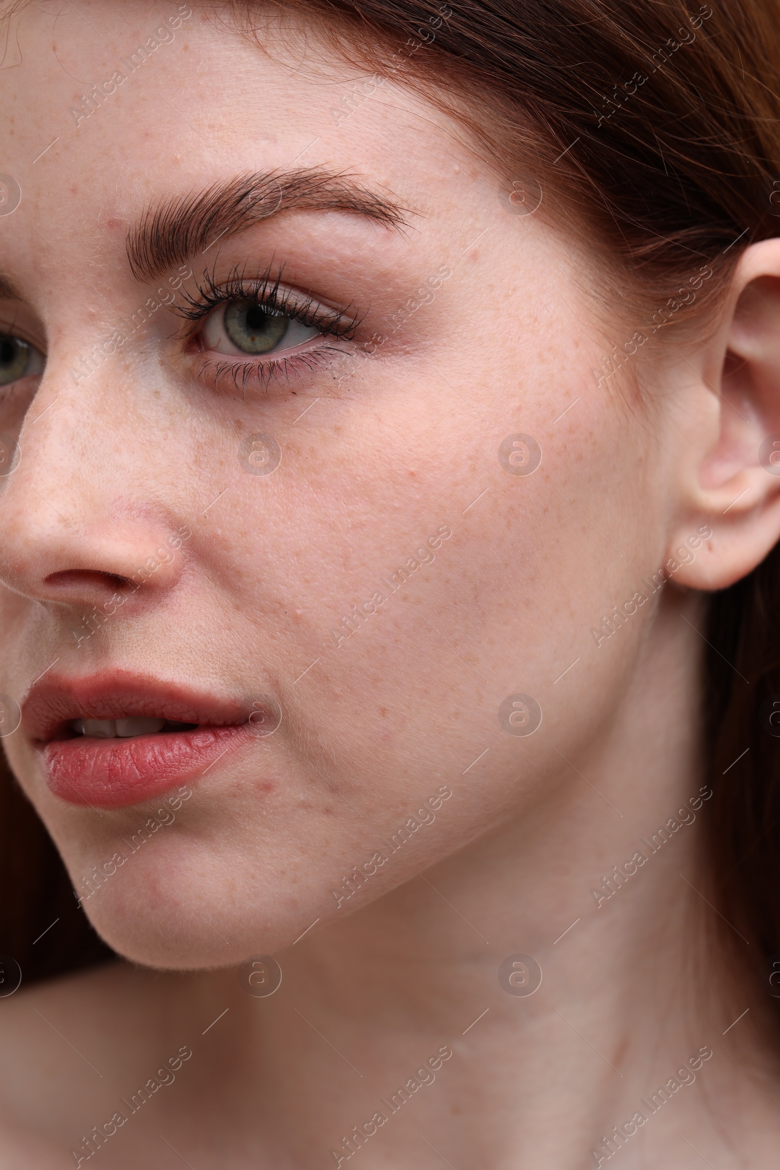 Photo of Portrait of beautiful woman with freckles, closeup