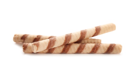 Tasty wafer roll sticks on white background. Crispy food