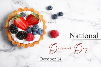 Image of National Dessert Day, October 14. Tasty tartlet with different fresh berries on white marble table