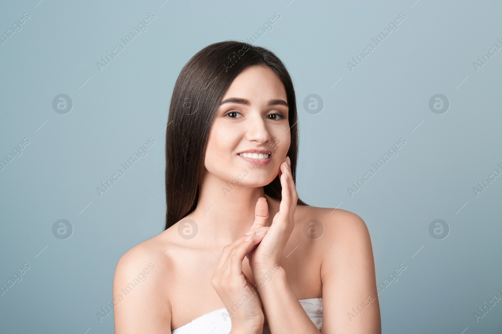 Photo of Portrait of beautiful woman on color background. Cosmetology and spa