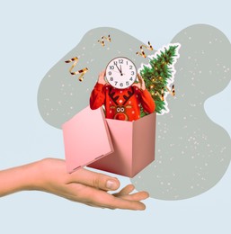 Christmas art collage. Man with clock head and fir tree popping out of gift box on woman's hand against color background