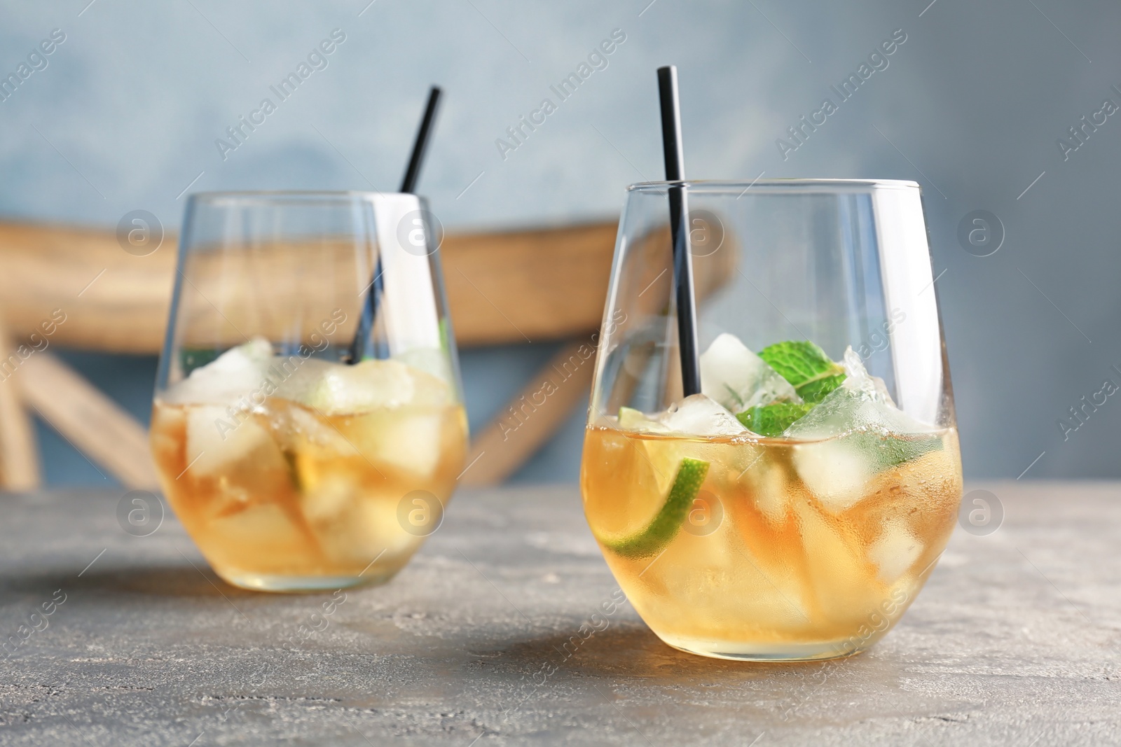 Photo of Glasses with delicious mint julep cocktail on table