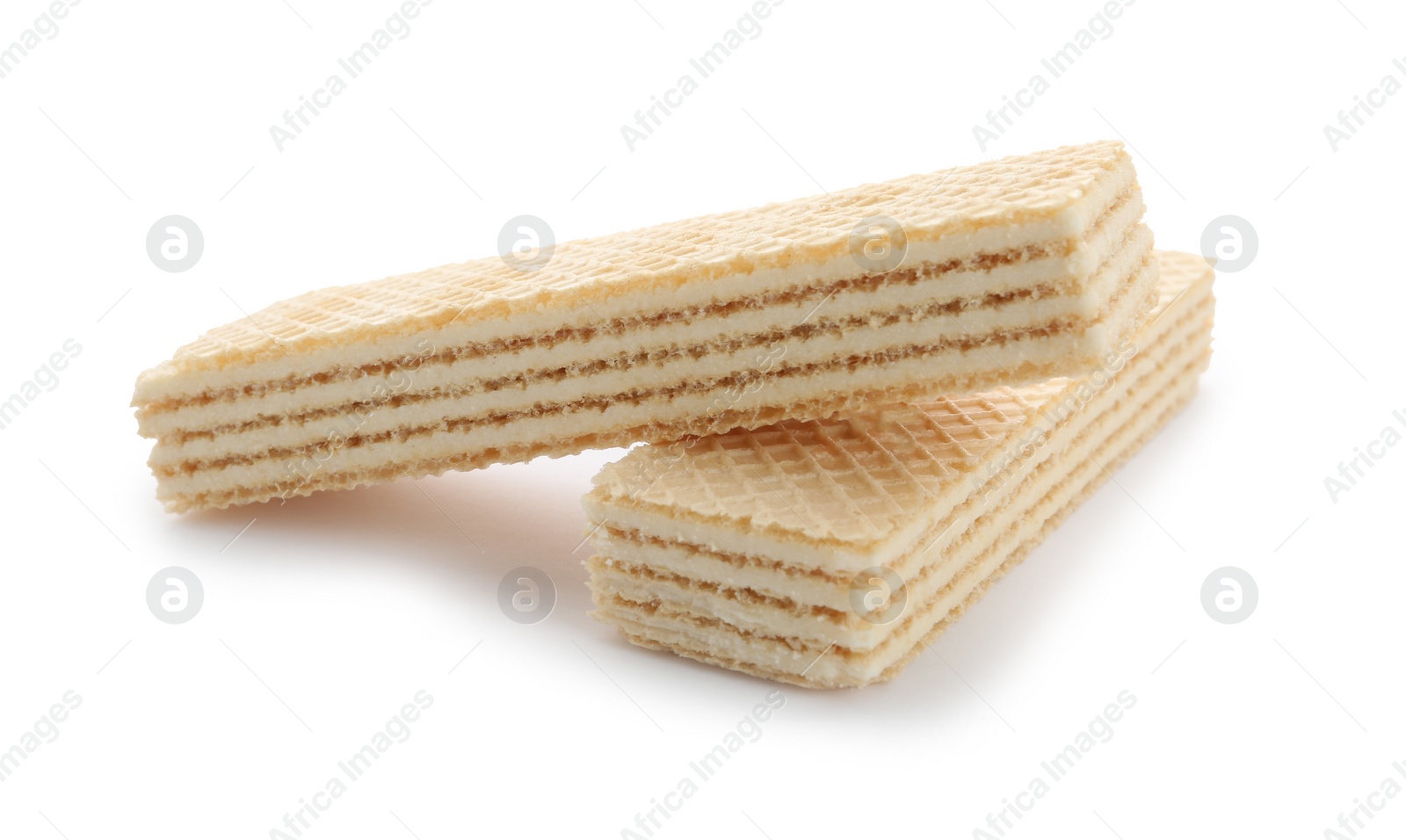 Photo of Delicious vanilla wafer sticks isolated on white