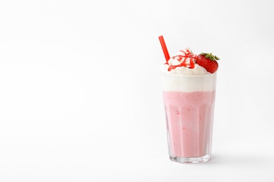 Photo of Glass with delicious milk shake on white background