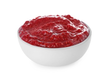 Photo of Raspberry puree in bowl on white background