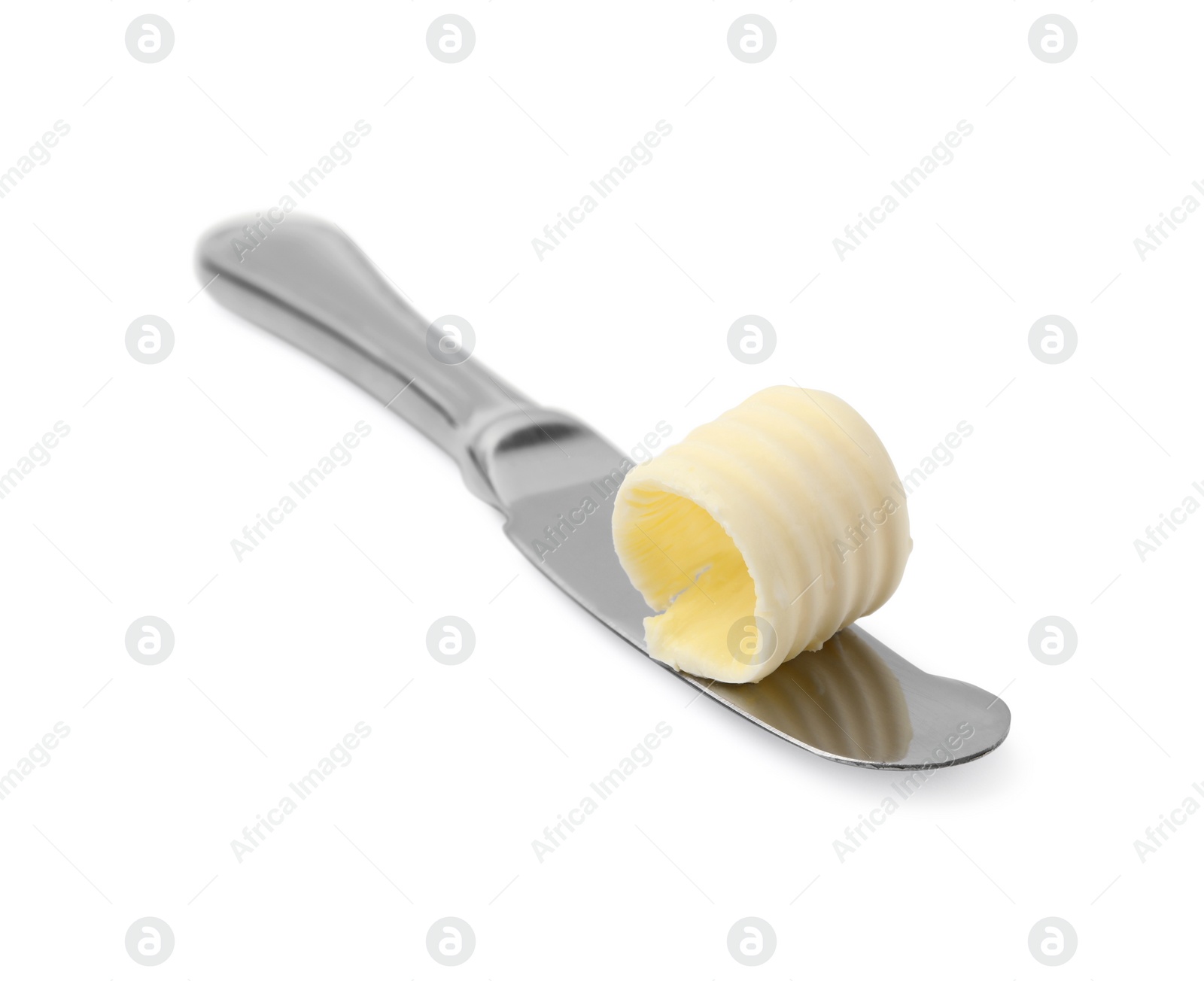 Photo of Butter curl on knife isolated on white