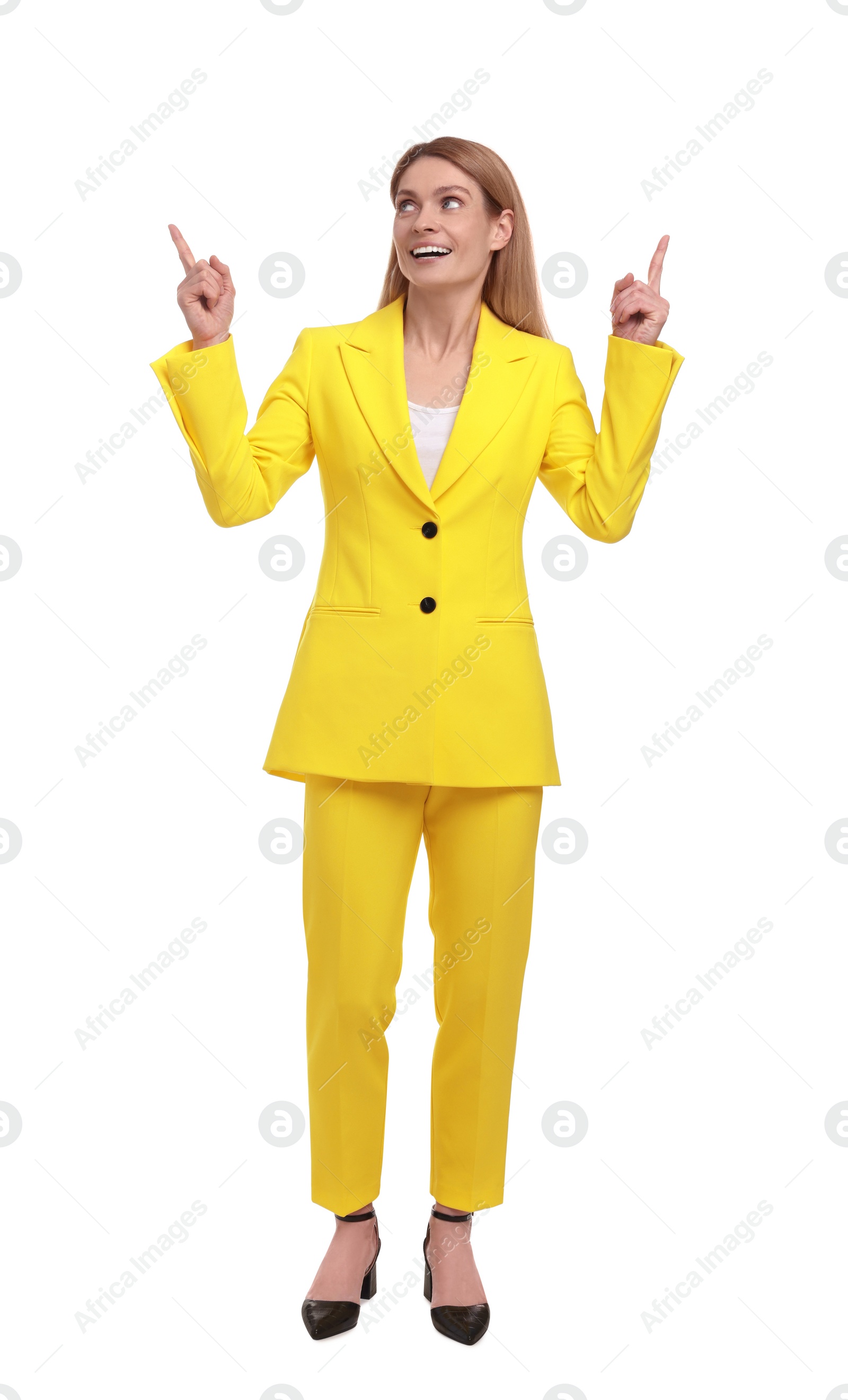 Photo of Beautiful happy businesswoman pointing at something on white background