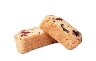 Photo of Slices of tasty cantucci with berry on white background. Traditional Italian almond biscuits