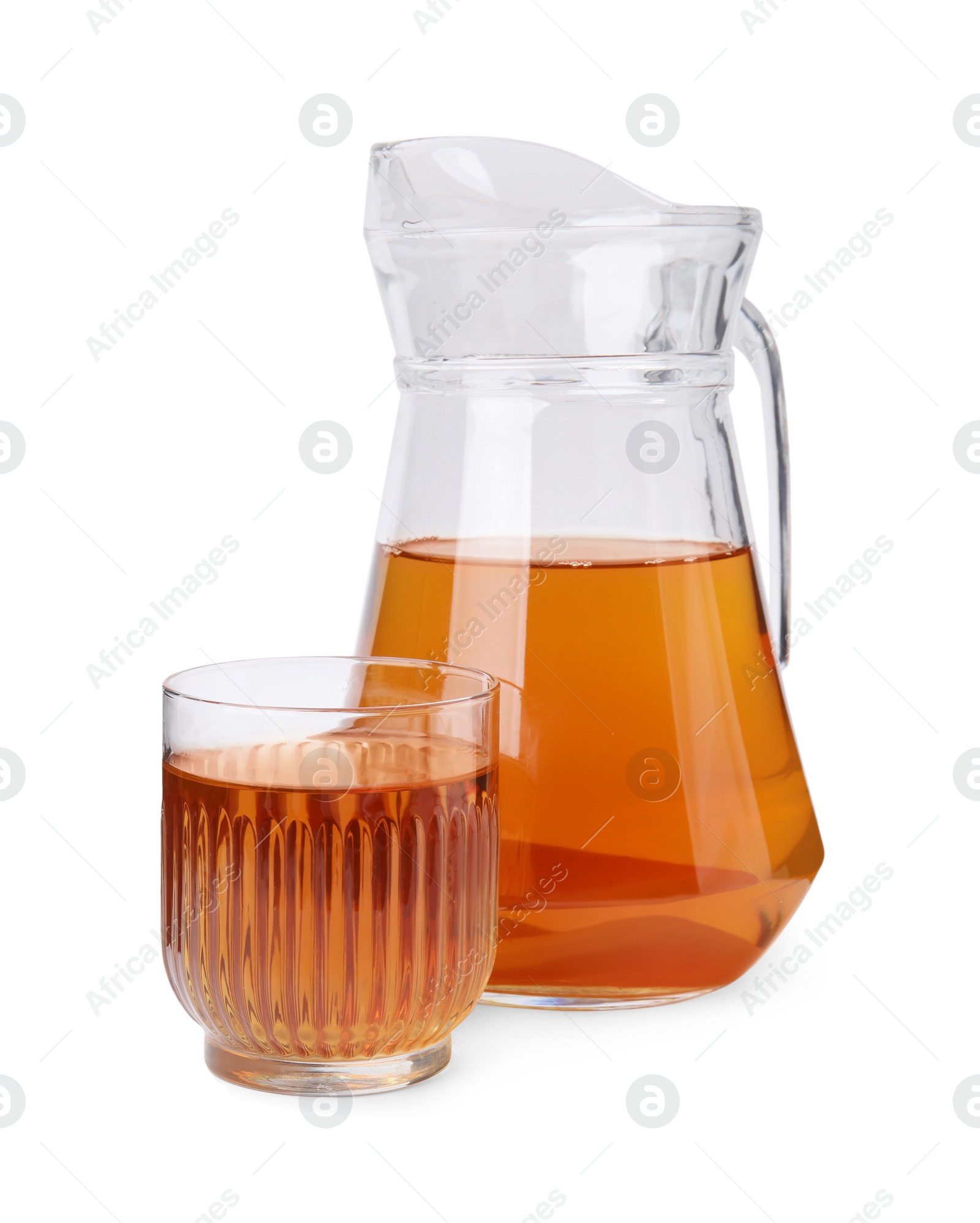 Photo of Tasty kombucha in glass and jug isolated on white