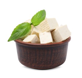 Photo of Delicious tofu cheese and basil isolated on white