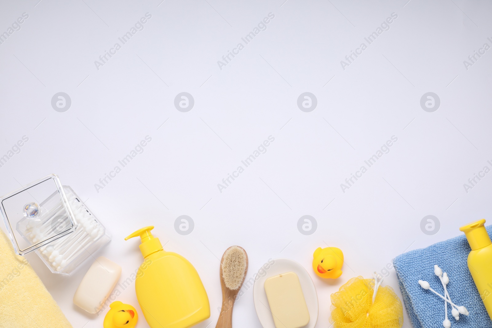 Photo of Different baby bath accessories and cosmetic products on white background, flat lay. Space for text