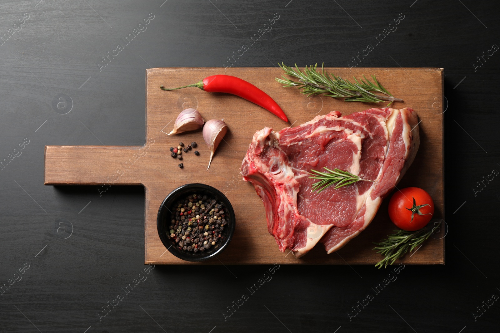 Photo of Composition with fresh meat on black table, top view