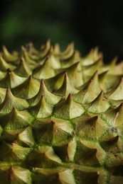 Photo of Closeup view of ripe durian on blurred background