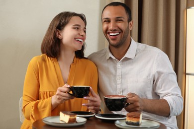 Photo of Romantic date. Happy couple spending time together in cafe