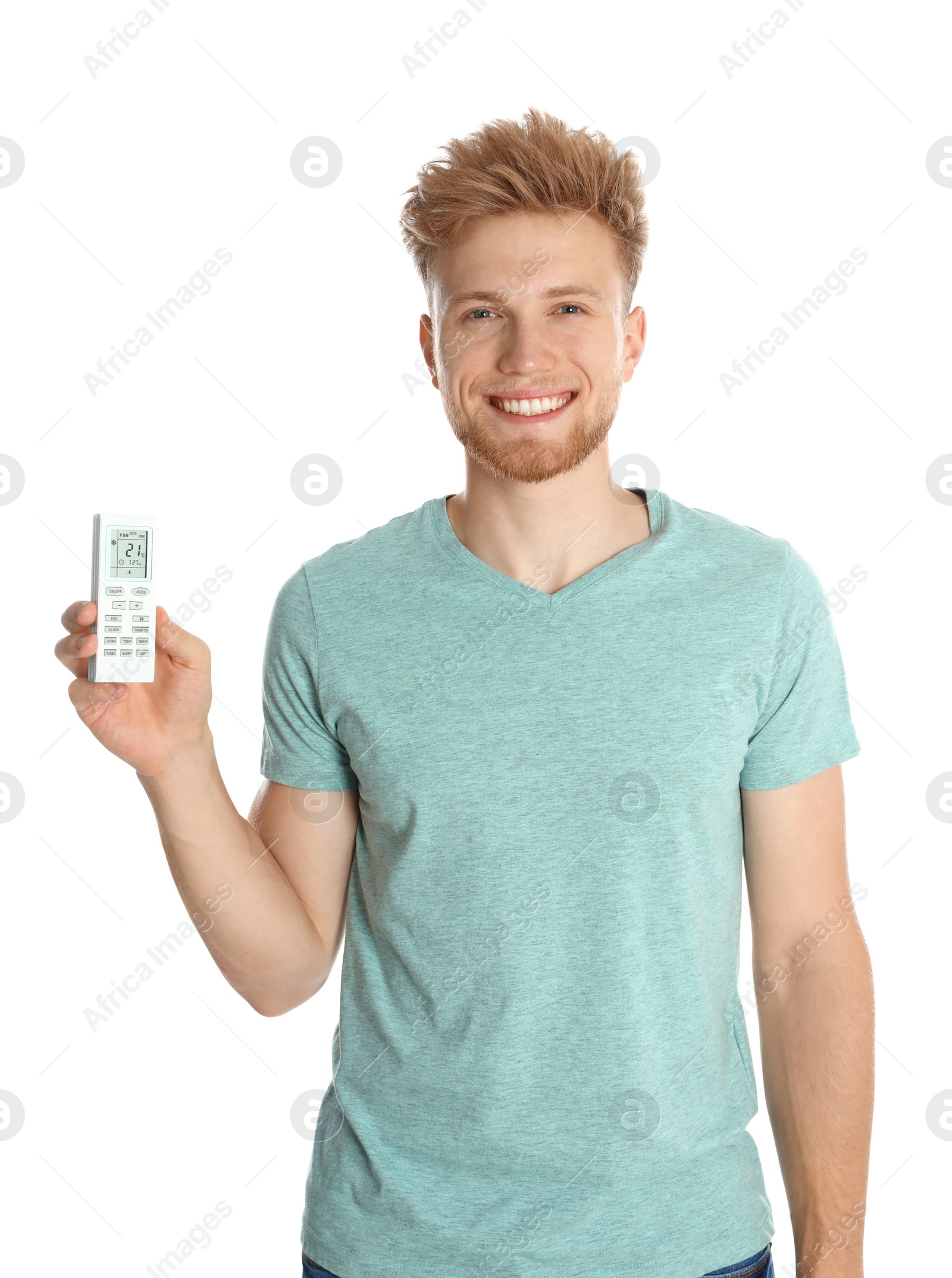 Photo of Young man with air conditioner remote on white background