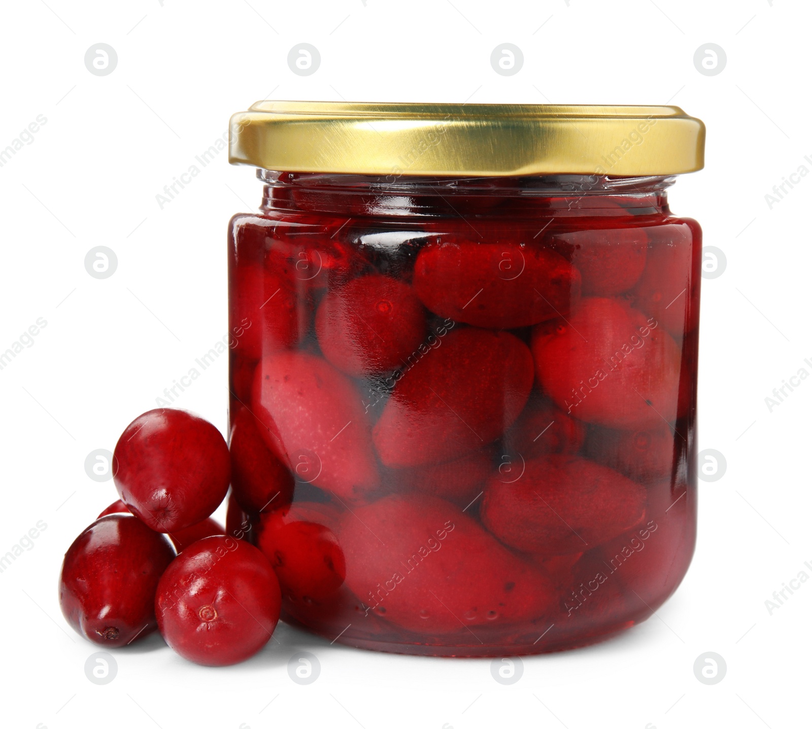 Photo of Delicious dogwood jam with berries on white background