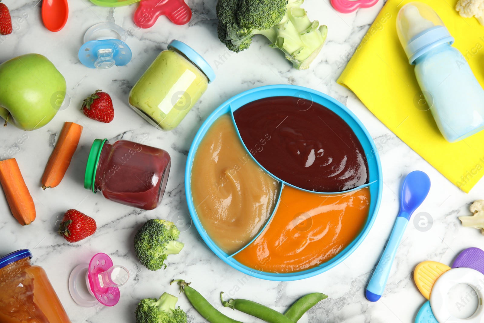 Photo of Flat lay composition with healthy baby food, ingredients and accessories on white marble table