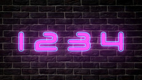 Image of Glowing neon number (1, 2, 3, 4) signs on brick wall