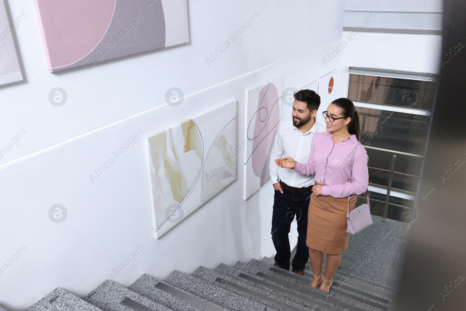 Photo of Happy couple at exhibition in art gallery