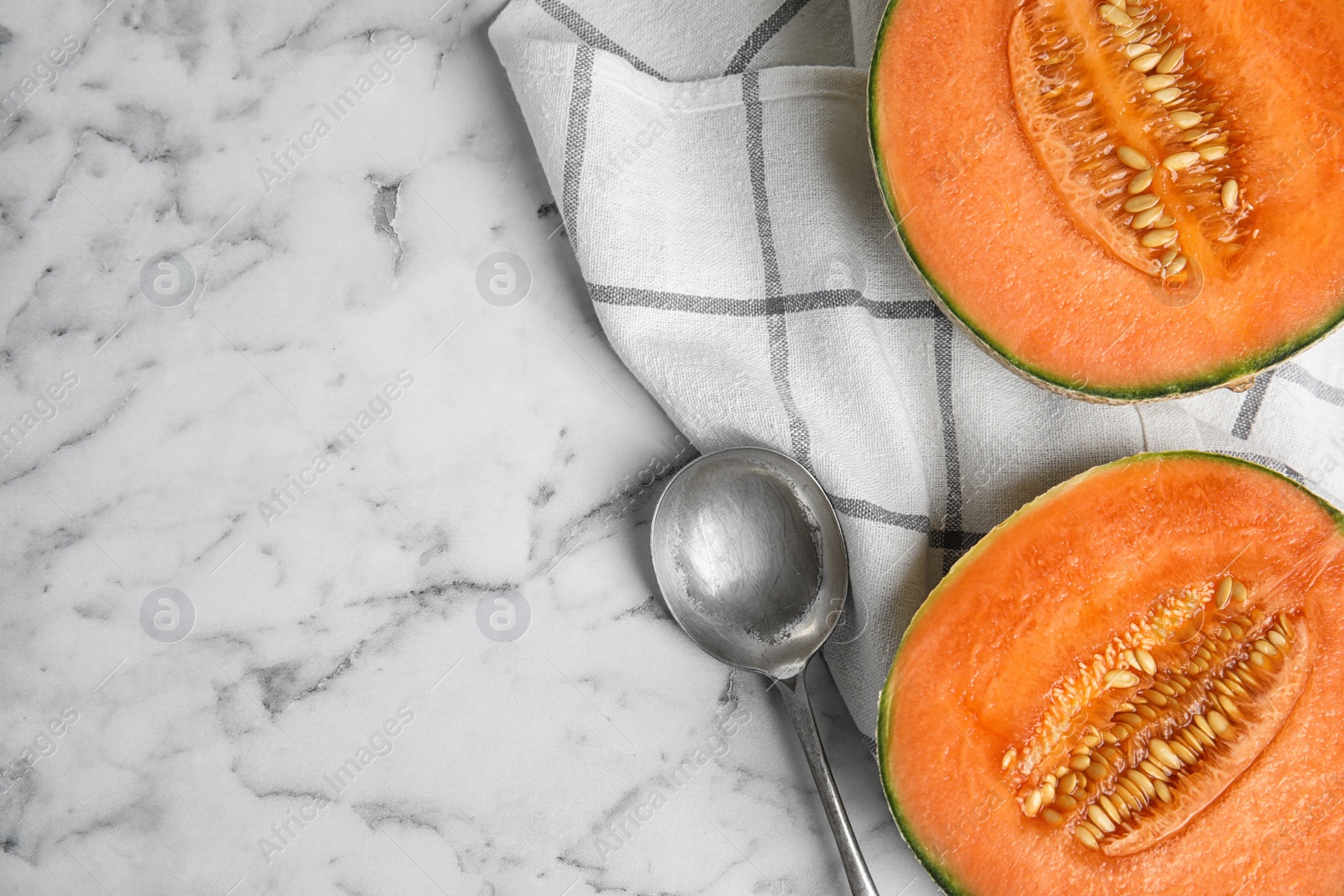 Photo of Flat lay composition with ripe cantaloupe melon on white marble table. Space for text