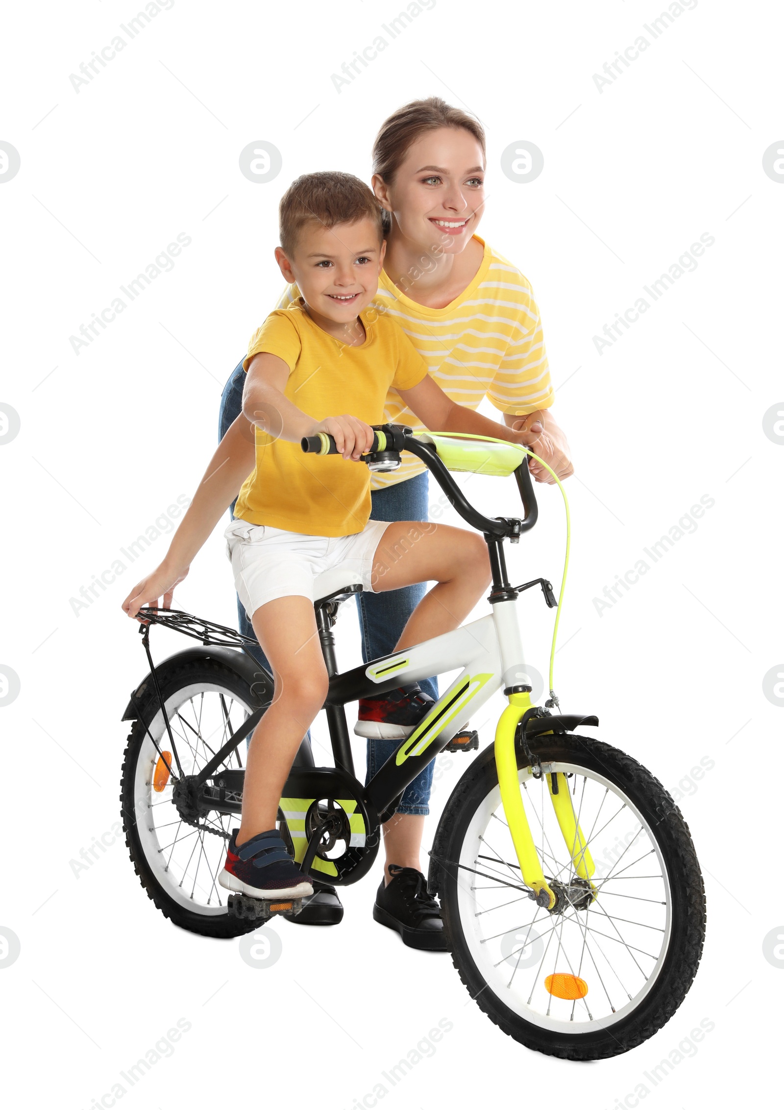 Photo of Young mother teaching son to ride bicycle on white background