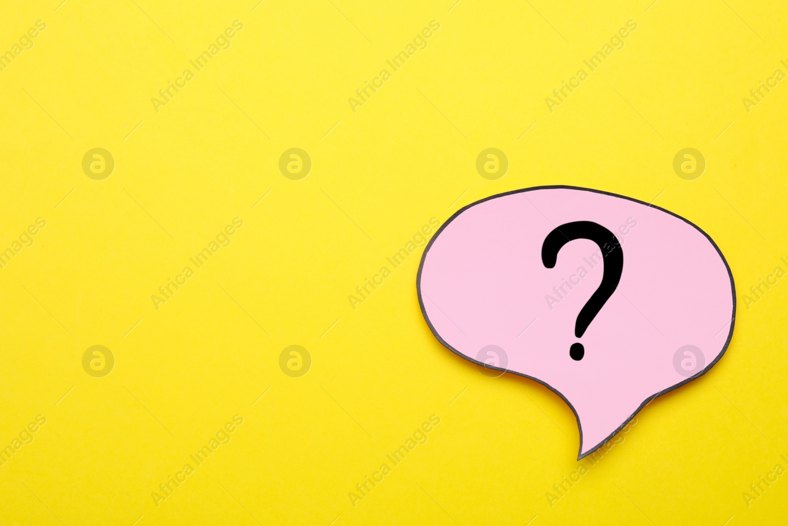 Photo of Paper speech bubble with question mark on yellow background, top view. Space for text